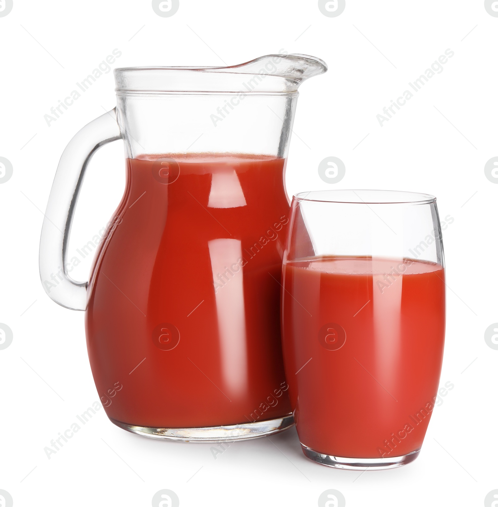 Photo of Fresh tomato juice in glass and jug isolated on white