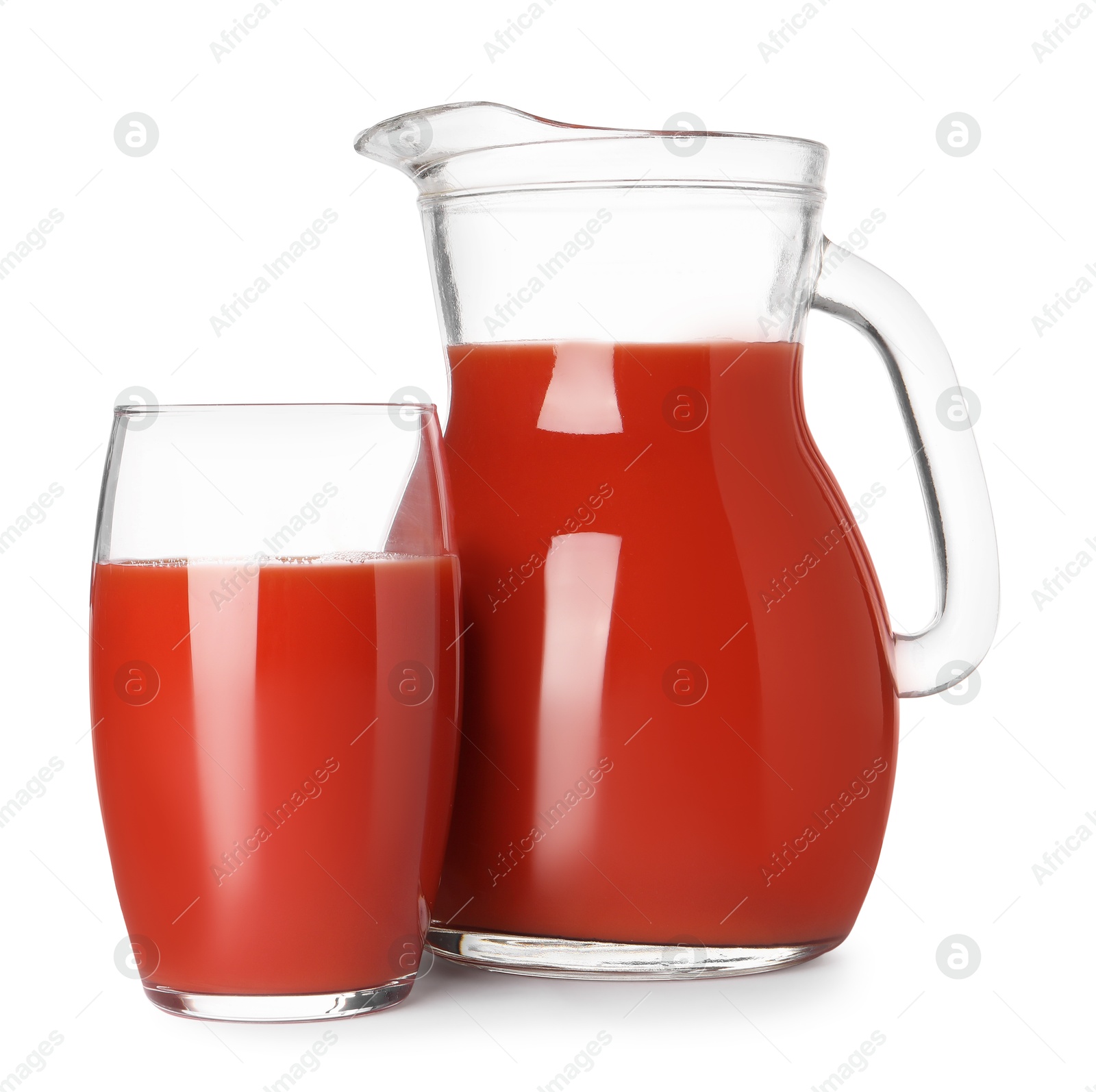 Photo of Fresh tomato juice in glass and jug isolated on white