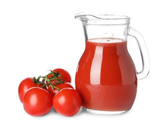 Tasty tomato juice in glass jug and fresh vegetables isolated on white