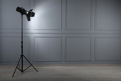 Professional lighting equipment in photo studio, space for text