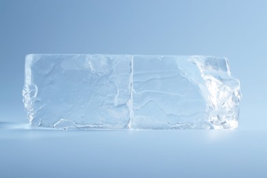 Blocks of clear ice on light blue background