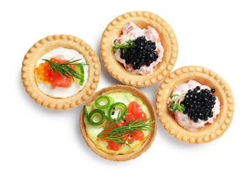 Photo of Delicious canapes with salmon and caviar isolated on white, top view