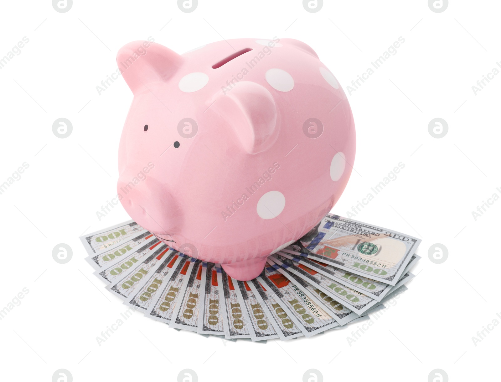 Photo of Pink piggy bank and money on white background