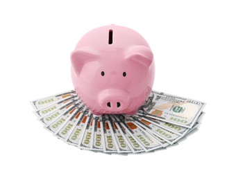 Pink piggy bank and money on white background