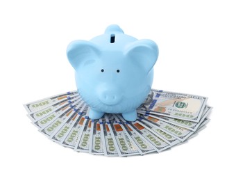 Photo of Light blue piggy bank and money on white background