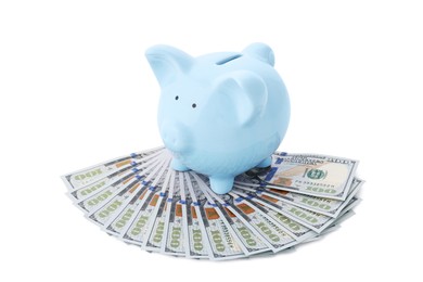 Light blue piggy bank and money on white background