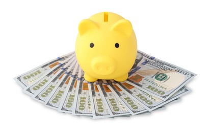 Photo of Yellow piggy bank and money on white background