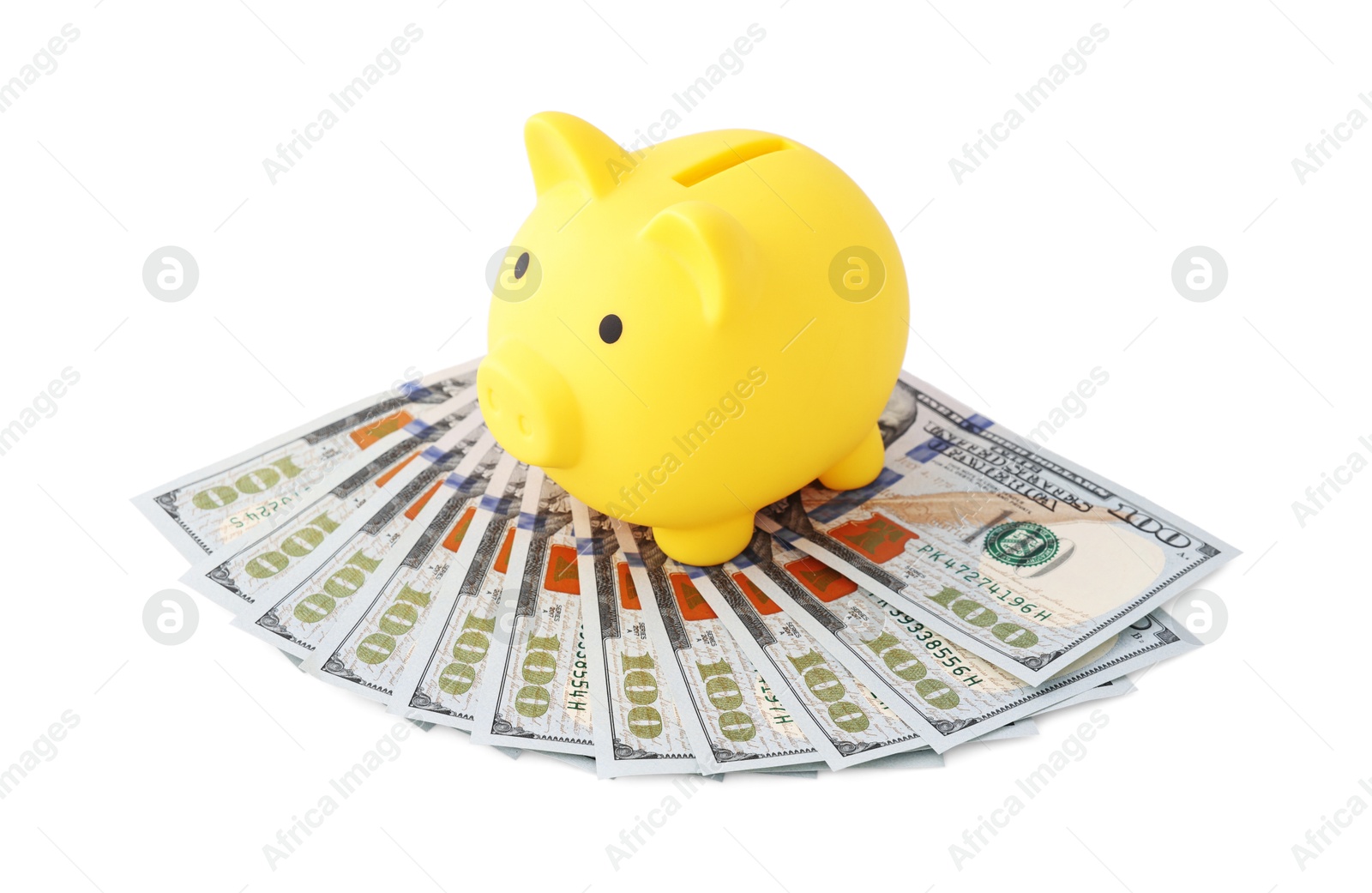 Photo of Yellow piggy bank and money on white background