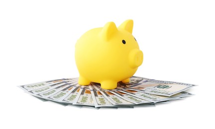 Photo of Yellow piggy bank and money on white background