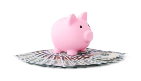 Pink piggy bank and money on white background