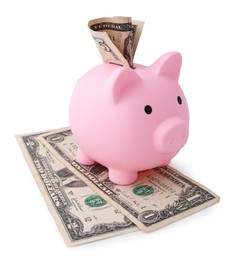 Pink piggy bank and money on white background