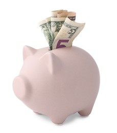 Piggy bank with money on white background