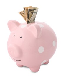 Photo of Pink piggy bank with money on white background