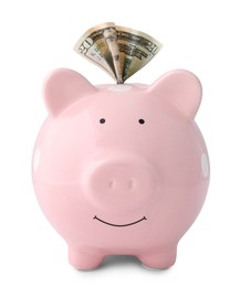 Pink piggy bank with money on white background