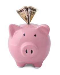 Photo of Pink piggy bank with money on white background