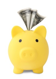 Yellow piggy bank with money on white background