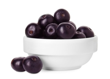 Photo of Fresh ripe acai berries in bowl isolated on white