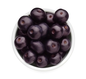 Photo of Fresh ripe acai berries in bowl isolated on white, top view