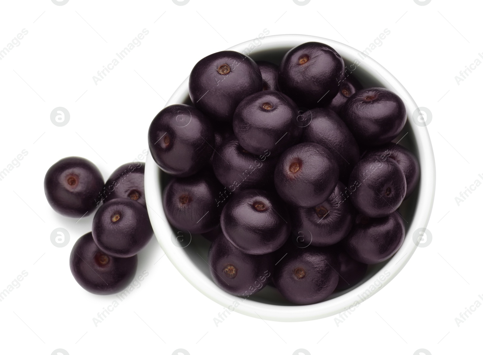 Photo of Fresh ripe acai berries in bowl isolated on white, top view