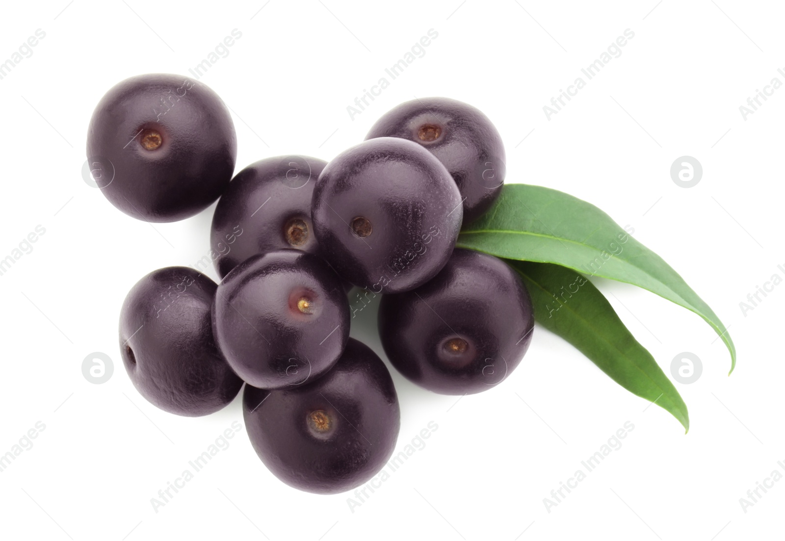 Photo of Fresh ripe acai berries and green leaves isolated on white, top view