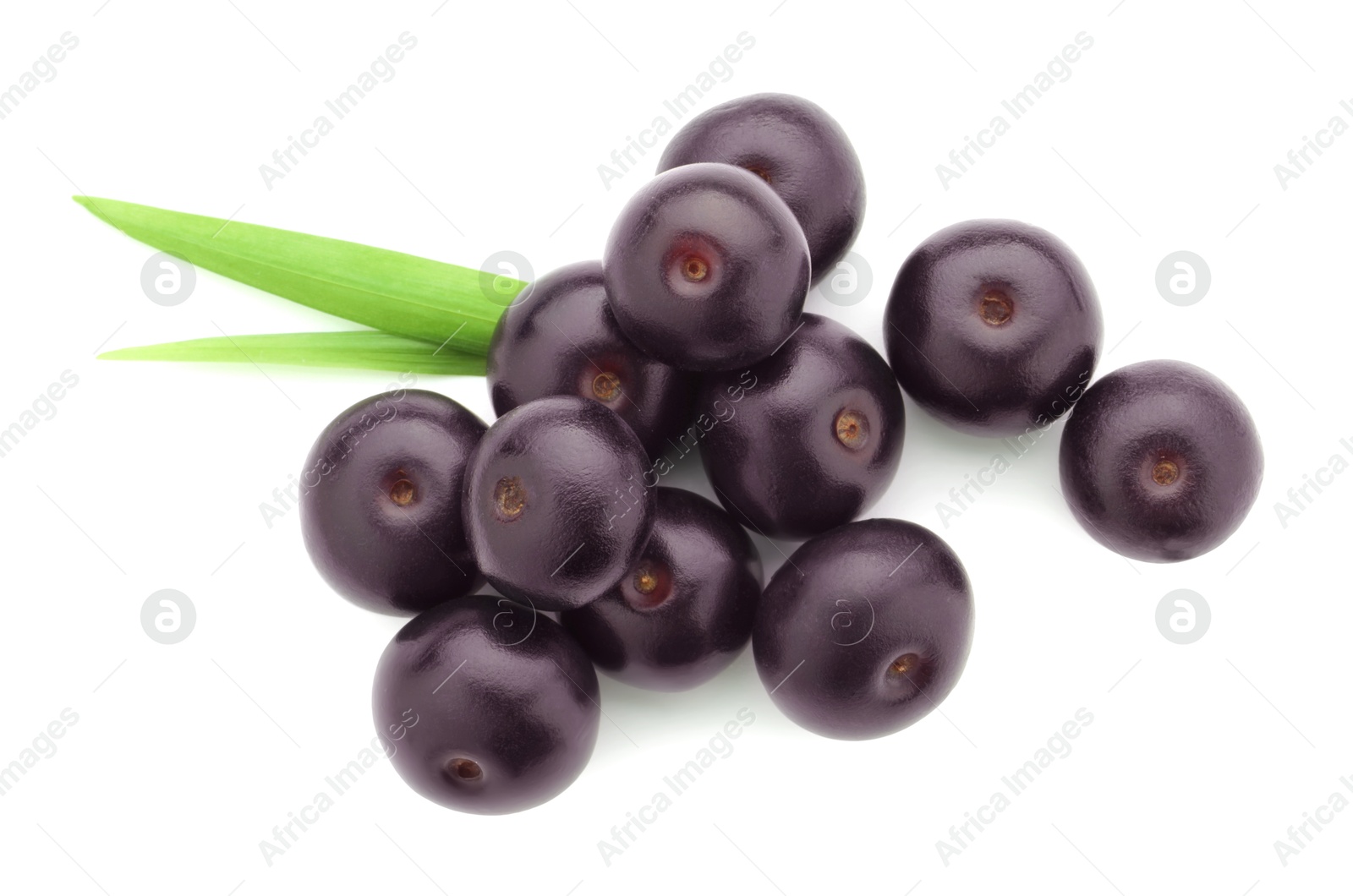 Photo of Fresh ripe acai berries and green leaves isolated on white, top view