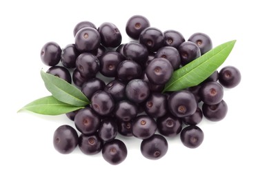 Photo of Fresh ripe acai berries and green leaves isolated on white, top view