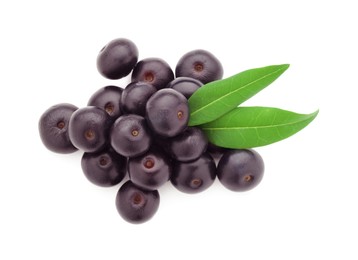 Photo of Fresh ripe acai berries and green leaves isolated on white, top view