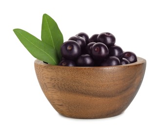 Photo of Fresh ripe acai berries in bowl and green leaves isolated on white