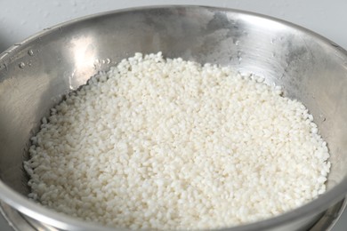 Closeup view of raw rice in bowl