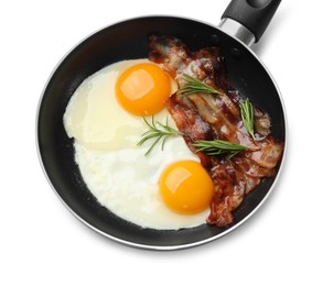 Photo of Tasty bacon, eggs and rosemary in frying pan isolated on white, top view