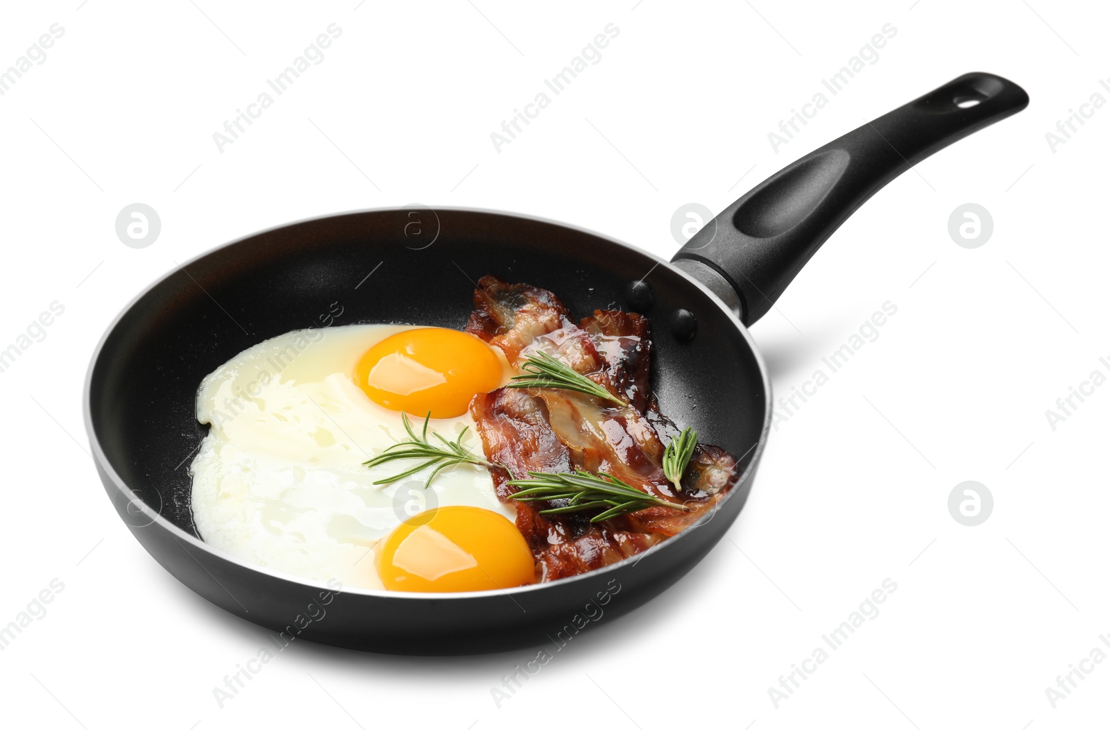 Photo of Tasty bacon, eggs and rosemary in frying pan isolated on white