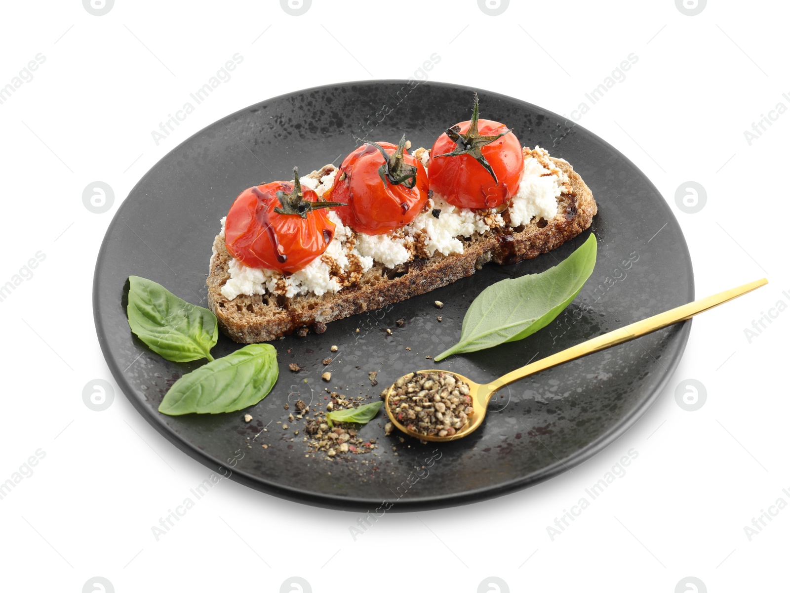 Photo of Delicious ricotta bruschetta with sun dried tomatoes, sauce, basil and milled pepper isolated on white