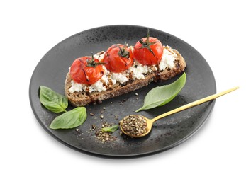 Photo of Delicious ricotta bruschetta with sun dried tomatoes, sauce, basil and milled pepper isolated on white
