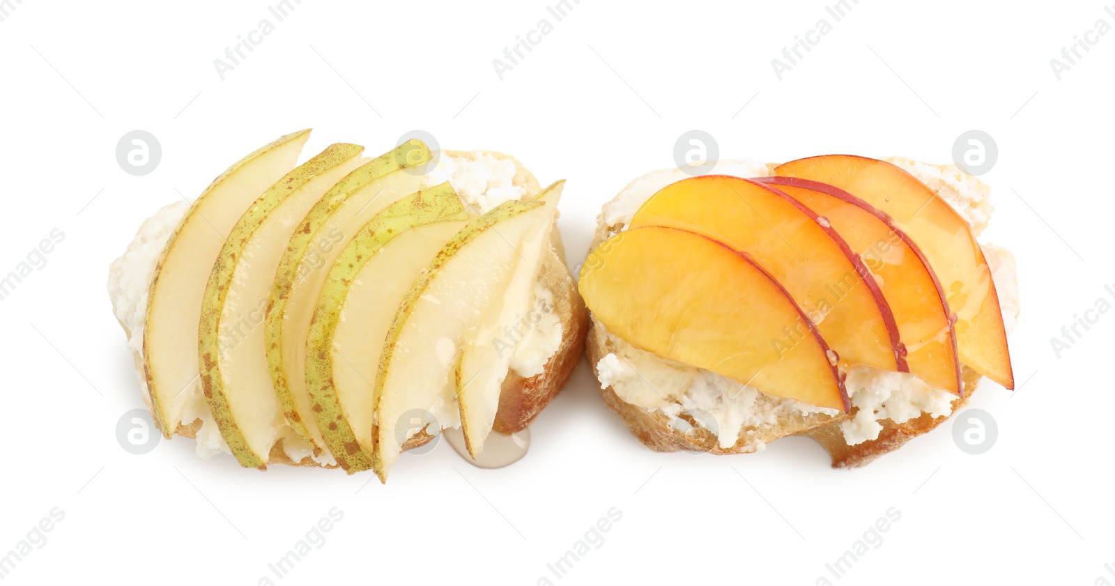 Photo of Delicious ricotta bruschettas with pears and apricots isolated on white, top view