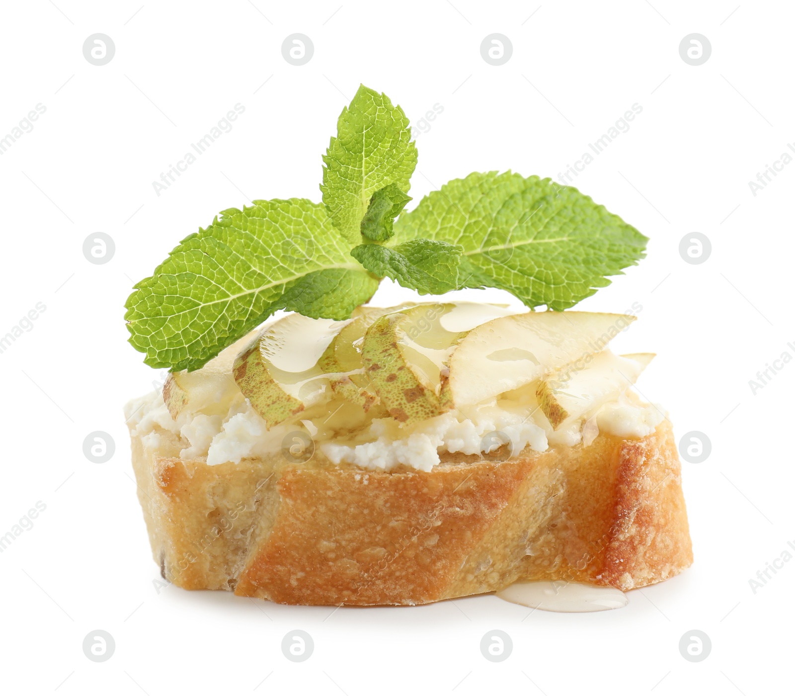 Photo of Delicious ricotta bruschetta with pear and mint isolated on white