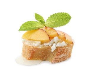 Photo of Delicious ricotta bruschetta with apricot and mint isolated on white