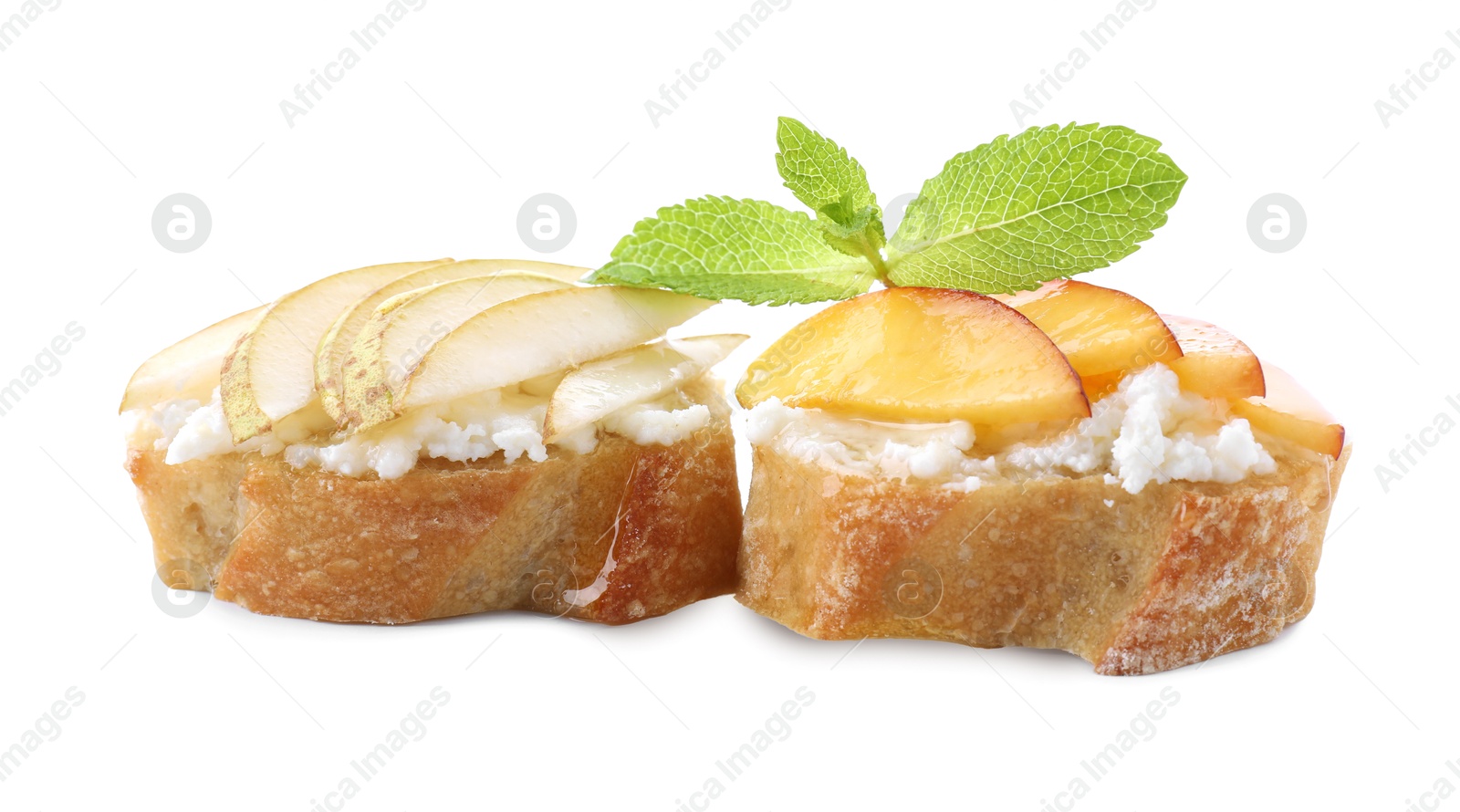 Photo of Delicious ricotta bruschettas with pears, apricots and mint isolated on white