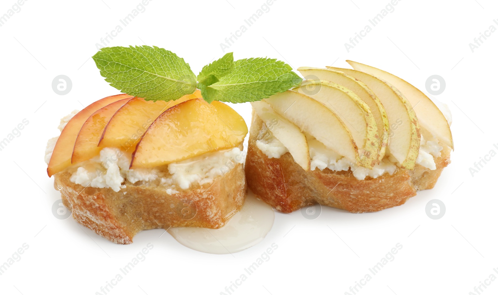 Photo of Delicious ricotta bruschettas with pears, apricots and mint isolated on white