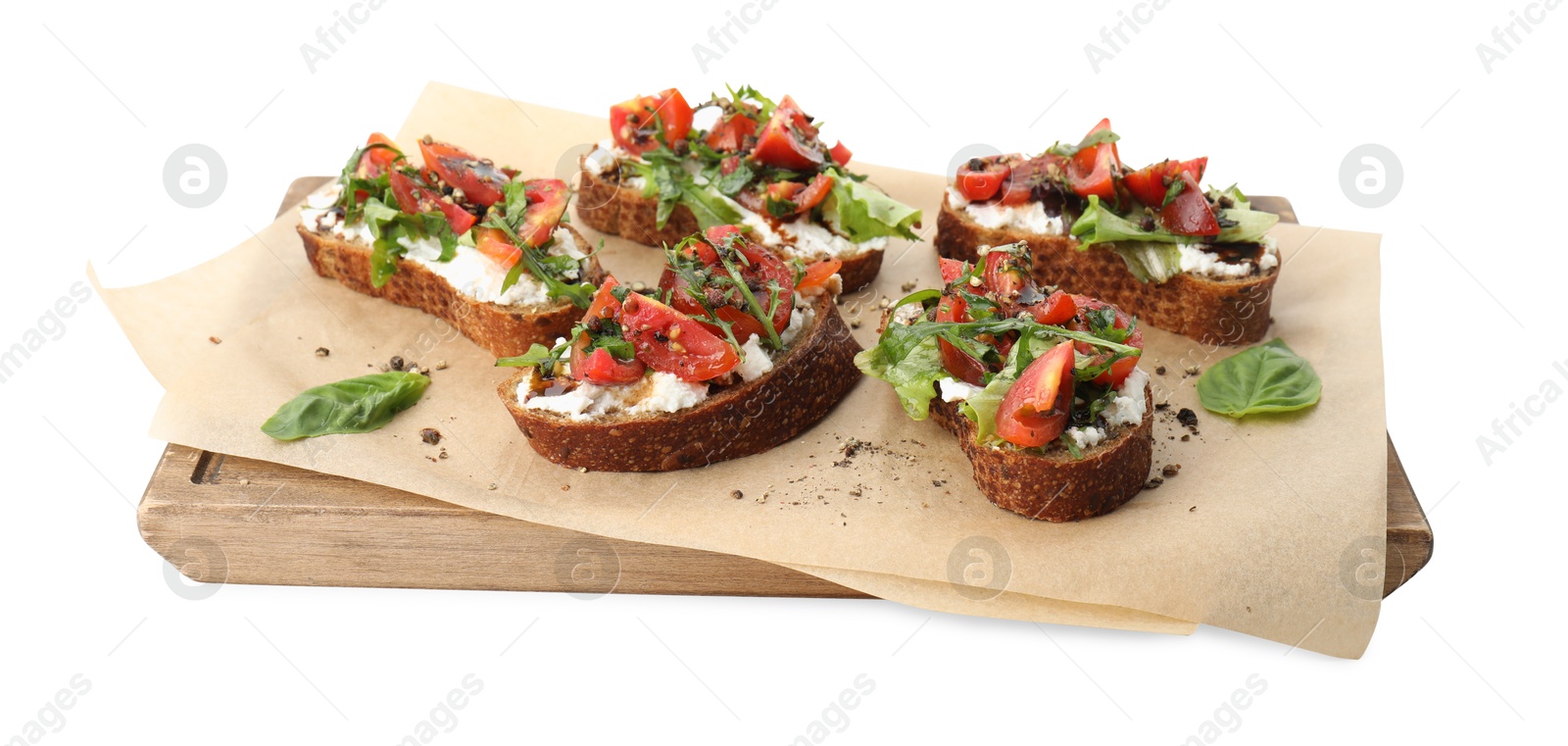 Photo of Delicious ricotta bruschettas with tomatoes, arugula and basil isolated on white