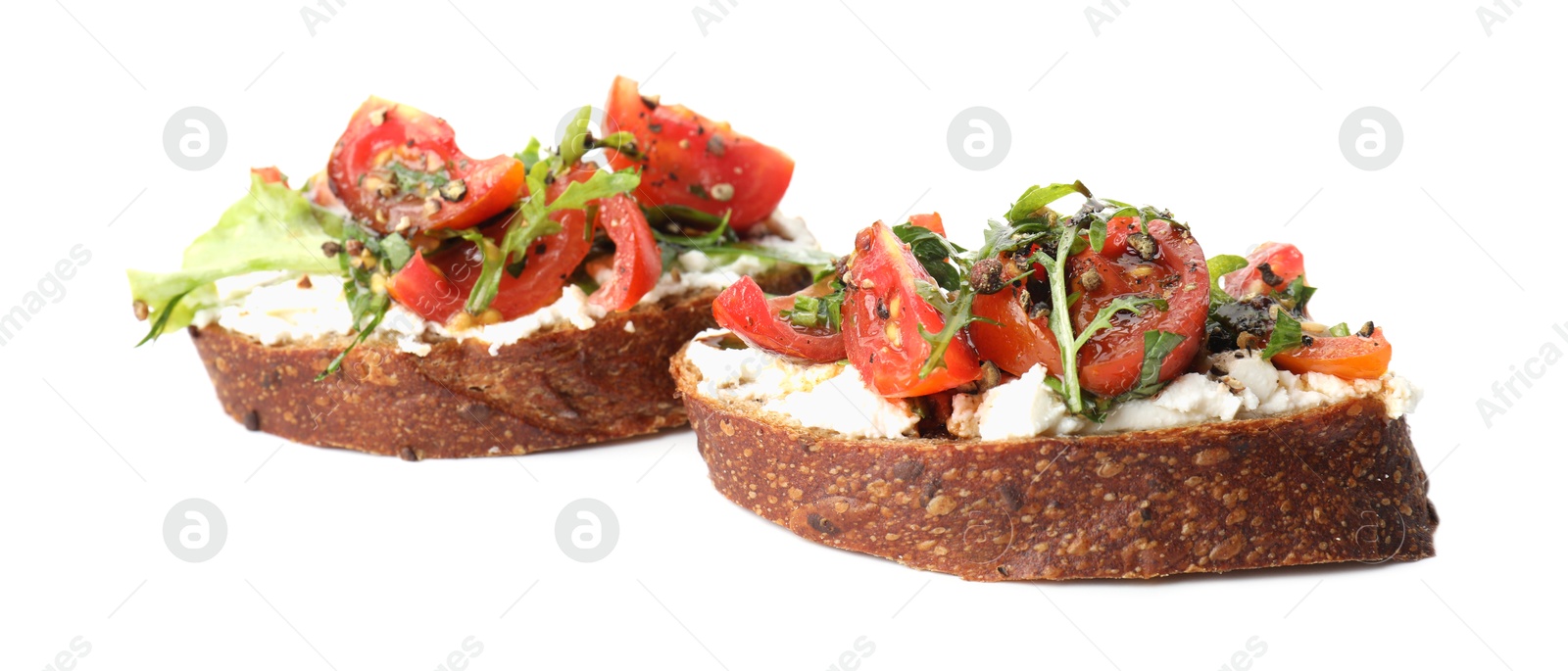 Photo of Delicious bruschettas with ricotta cheese, tomatoes and arugula isolated on white