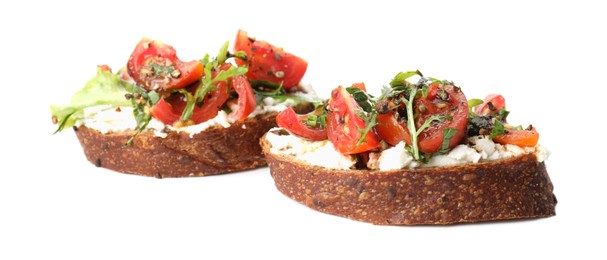 Photo of Delicious bruschettas with ricotta cheese, tomatoes and arugula isolated on white