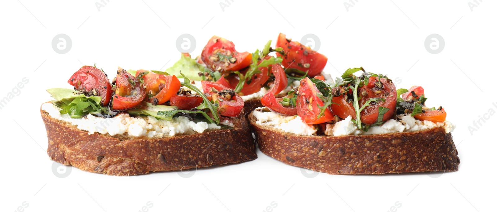 Photo of Delicious bruschettas with ricotta cheese, tomatoes and arugula isolated on white