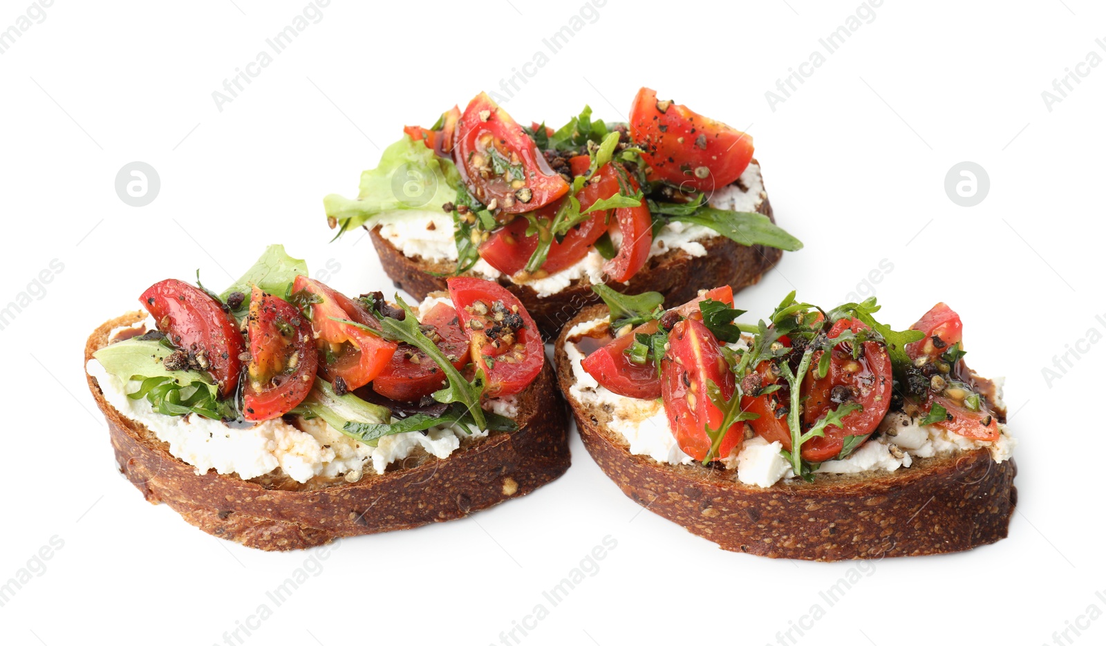 Photo of Delicious bruschettas with ricotta cheese, tomatoes and arugula isolated on white