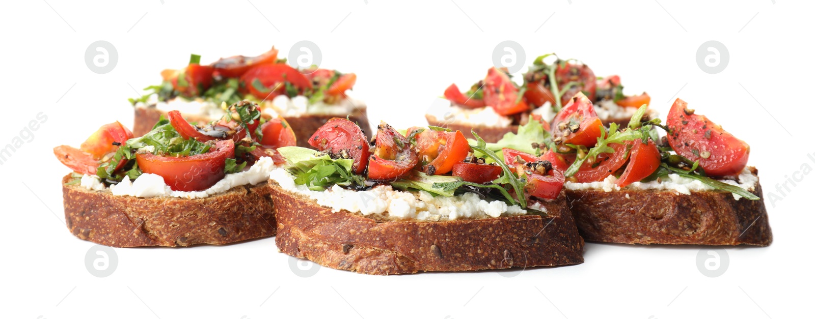 Photo of Delicious bruschettas with ricotta cheese, tomatoes and arugula isolated on white