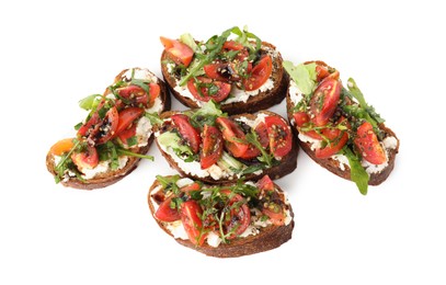 Photo of Delicious bruschettas with ricotta cheese, tomatoes and arugula isolated on white, top view