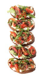 Photo of Delicious bruschettas with ricotta cheese, tomatoes and arugula isolated on white, top view
