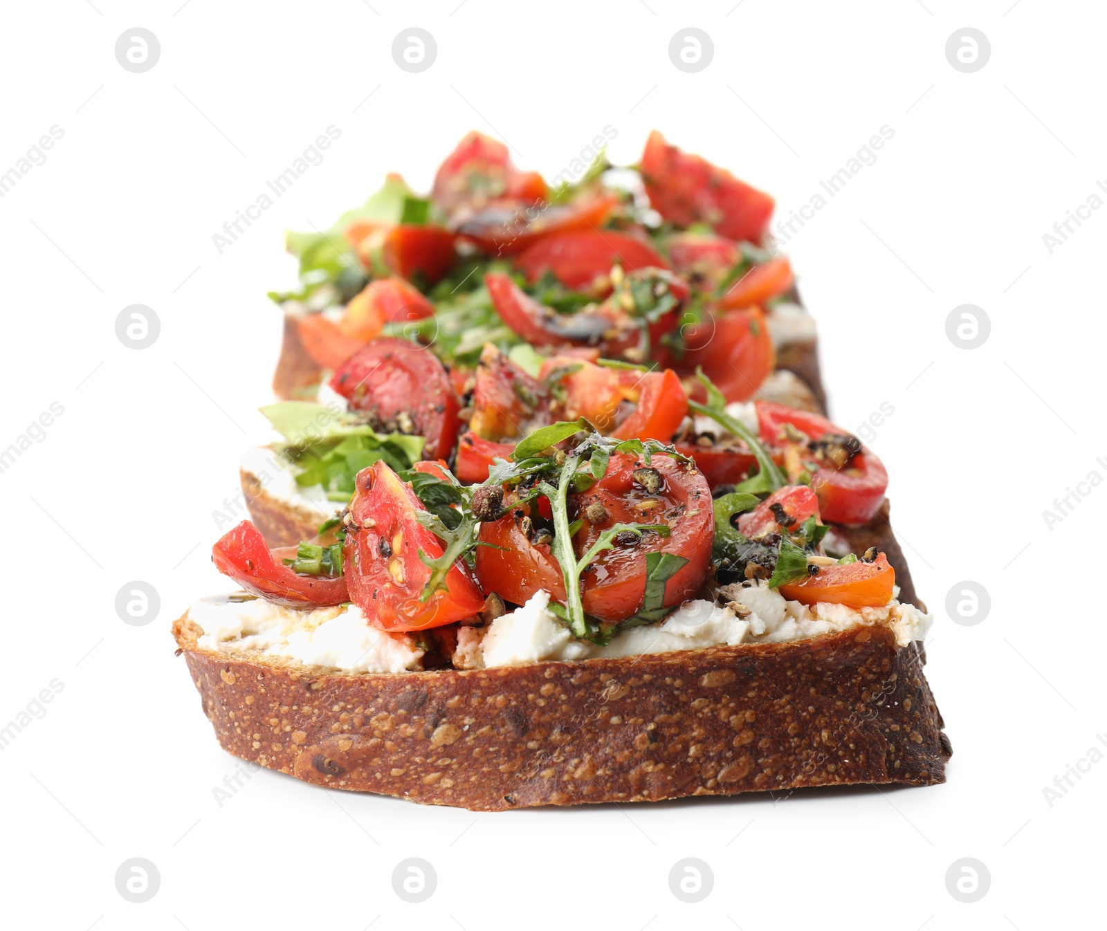 Photo of Delicious bruschetta with ricotta cheese, tomatoes and arugula isolated on white