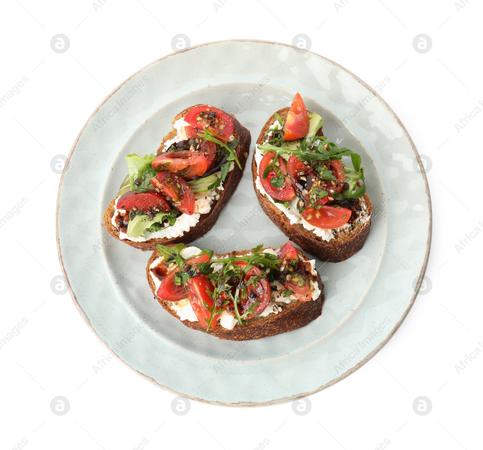 Photo of Delicious bruschettas with ricotta cheese, tomatoes and arugula isolated on white, top view