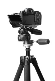 Modern camera with tripod isolated on white. Photographer's equipment