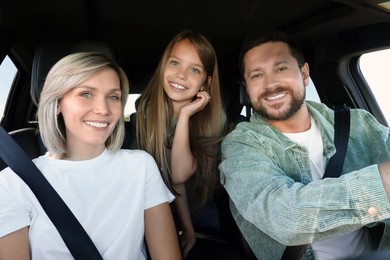 Happy family enjoying trip together by car, view from inside